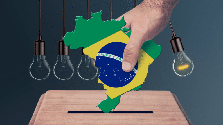 Mão inserindo mapa do Brasil estilizado com bandeira em urna, ao lado de lâmpadas, simbolizando a relação entre política e inovação