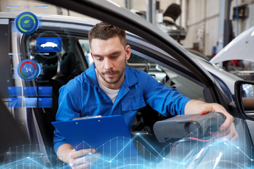 Mecânico analisando indicadores digitais (ECO, eficiência, telemetria) ao lado do carro — a cara da modernização e descarbonização que o Programa Mover impulsiona.