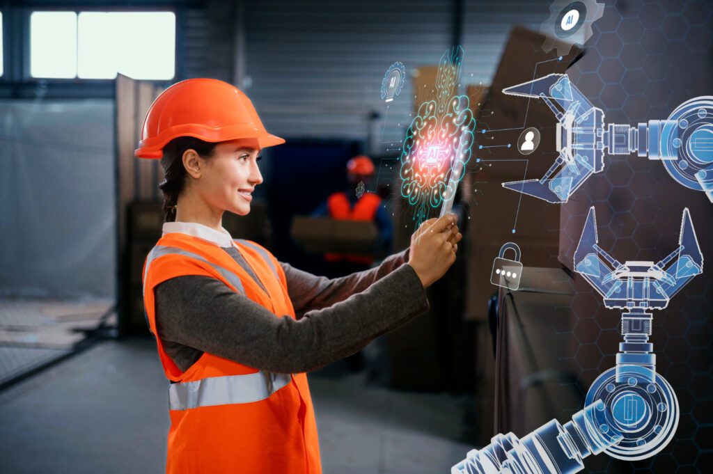 Engenheira com capacete e colete laranja usa um tablet em fábrica enquanto visualiza hologramas de IA e braços robóticos — referência a investimentos para impulsionar a inovação industrial